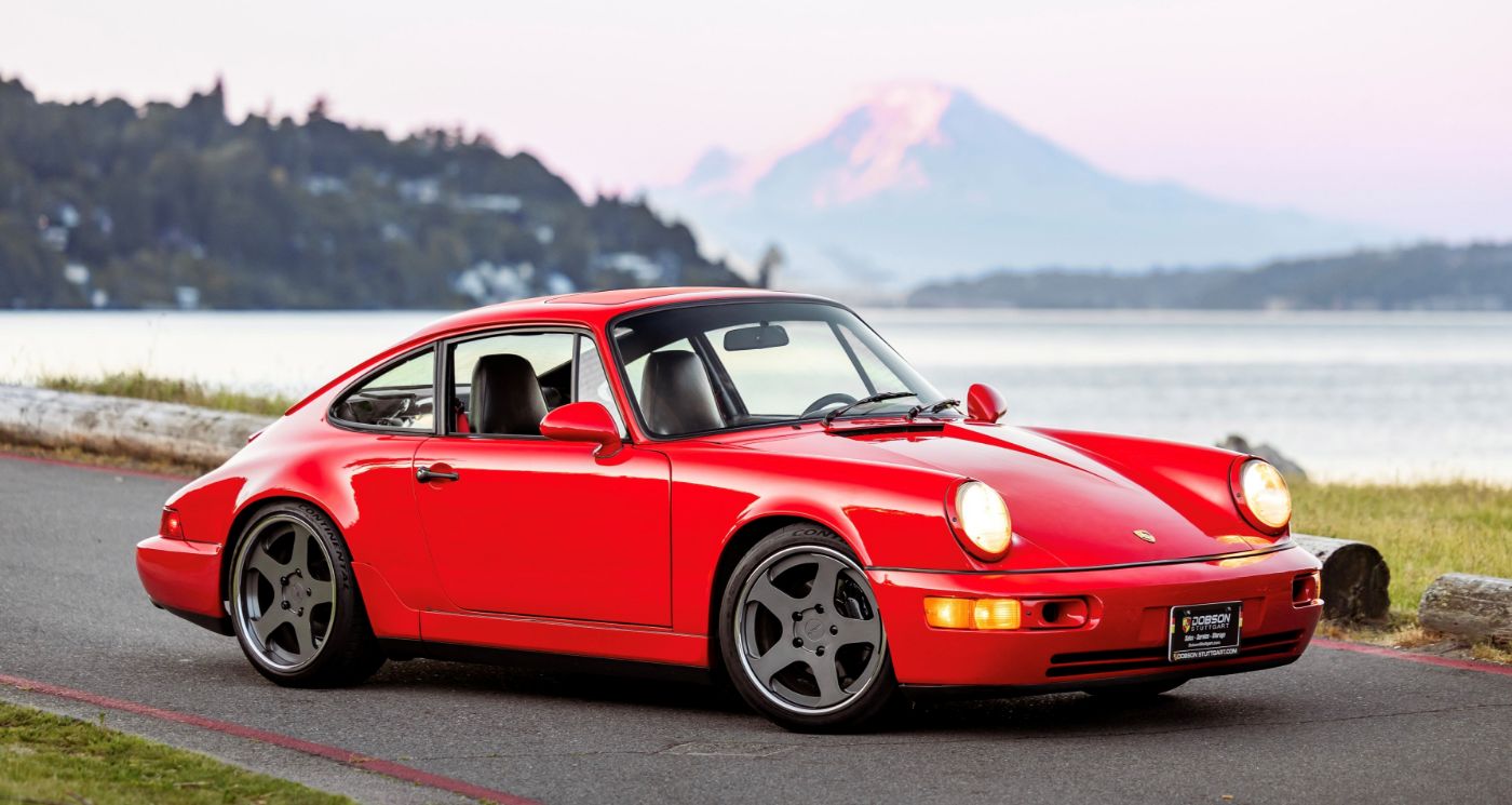 a red porsche with Mt. Ranier in the background