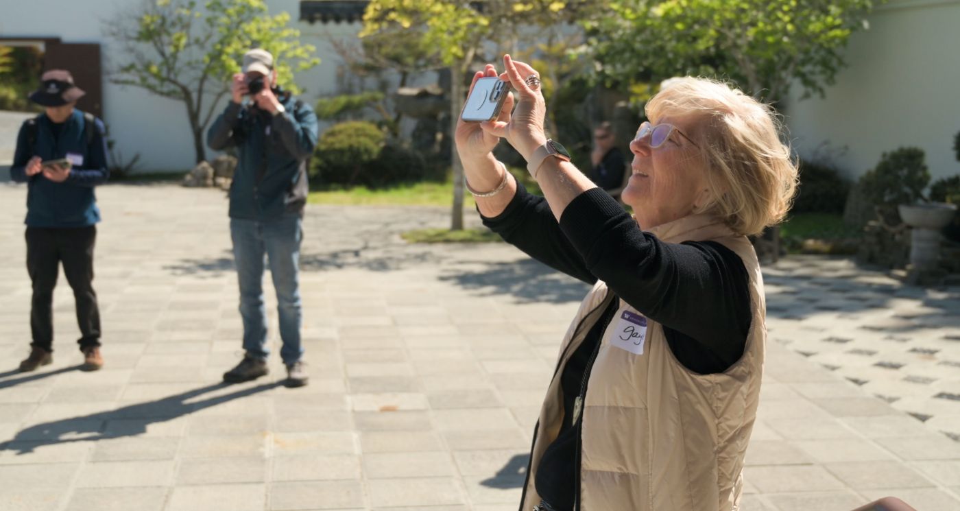 Gayle Sammons snaps a photo at the Seattle Chinese Garden.